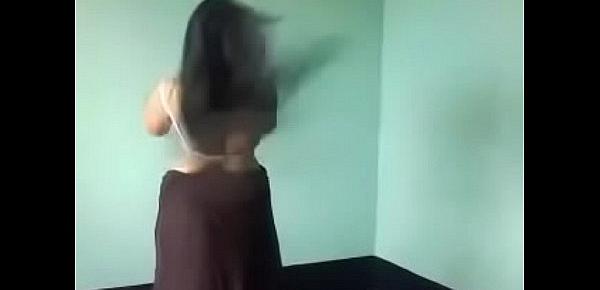  Removing her dress in bedroom